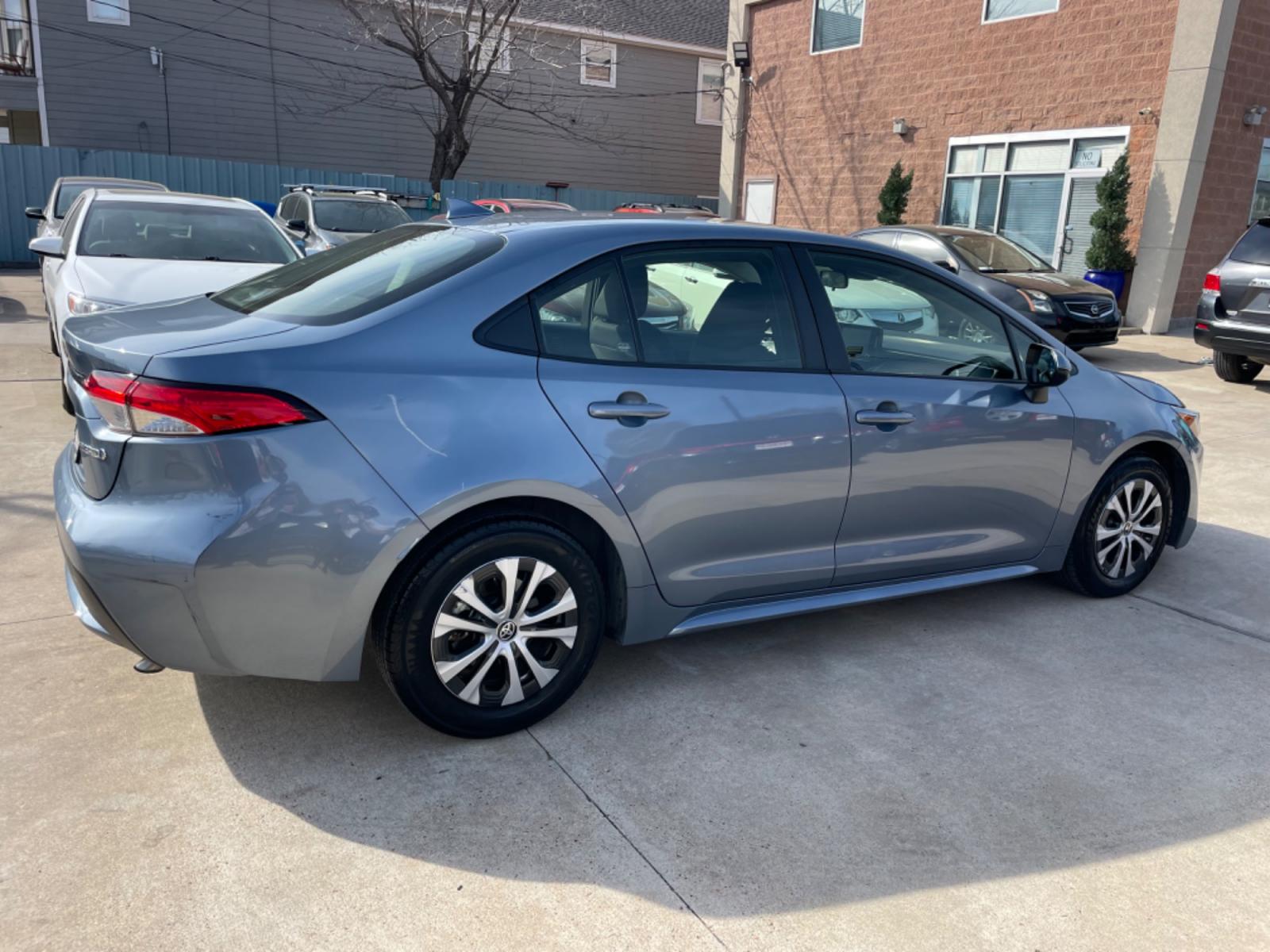2022 Blue /Silver Toyota Corolla LE (JTDEAMDEXNJ) with an 1.8L Hybrid engine, Automatic transmission, located at 1501 West 15th St., Houston, 77008, (713) 869-2925, 29.797941, -95.411789 - Photo #2